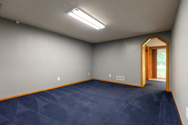 14500 Raleigh Ave, Savage, MN 55378 - unfurnished room with dark colored carpet and arched walkways