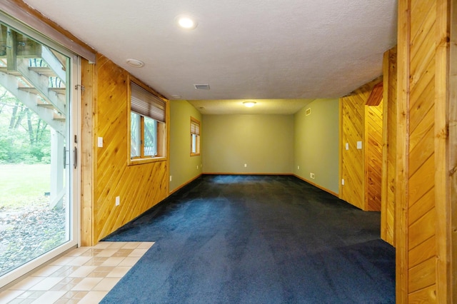 14500 Raleigh Ave, Savage, MN 55378 - carpeted spare room with baseboards and wood walls