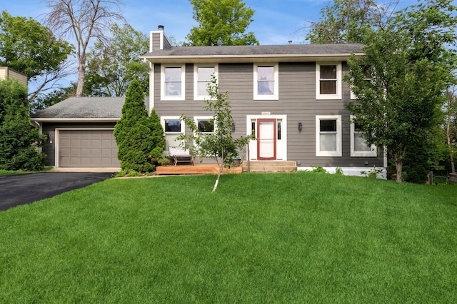14500 Raleigh Ave, Savage, MN 55378 - colonial home with a chimney, driveway, a front lawn, and an attached garage
