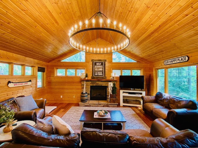 N14220 Island View Rd, Minong, WI 54859 - living area with hardwood / wood-style floors, wooden walls, wood ceiling, healthy amount of natural light, and a chandelier