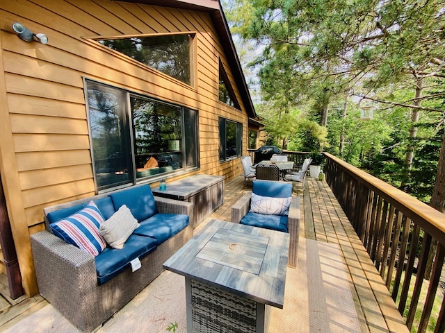 N14220 Island View Rd, Minong, WI 54859 - wooden deck featuring outdoor dining area and outdoor lounge area