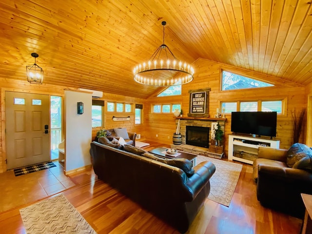 N14220 Island View Rd, Minong, WI 54859 - living room featuring wooden walls, wood ceiling, a chandelier, a stone fireplace, and high vaulted ceiling