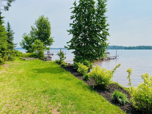 N14220 Island View Rd, Minong, WI 54859 - view of green lawn featuring a dock and a water view