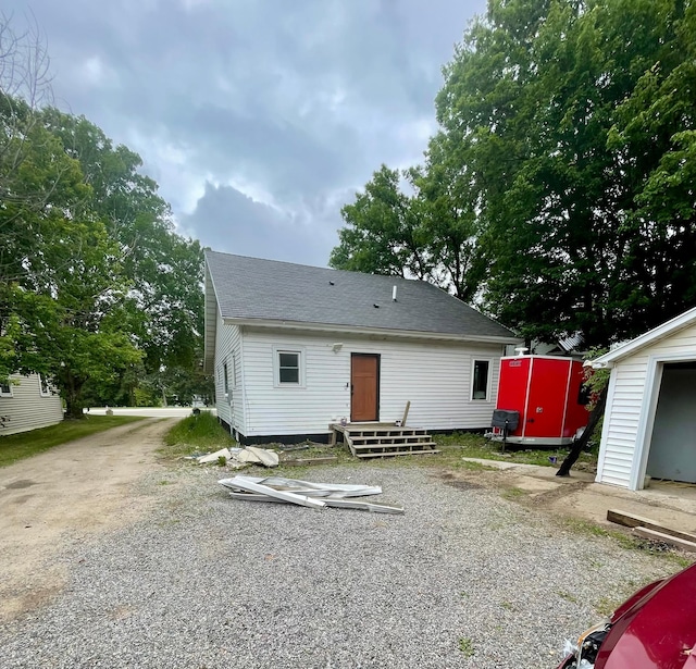 60 Main St, Kimball, MN 55353 - rear view of property featuring a shingled roof