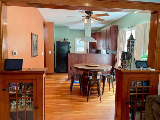 60 Main St, Kimball, MN 55353 - dining area with light wood-type flooring and ceiling fan