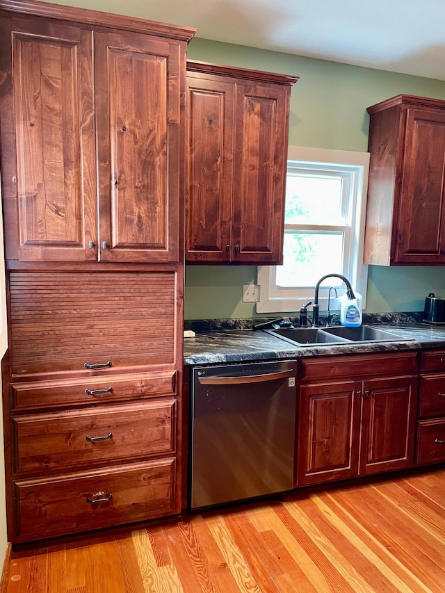 60 Main St, Kimball, MN 55353 - kitchen with dishwasher, dark countertops, and light wood-style flooring