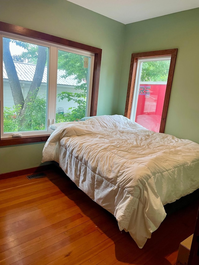 60 Main St, Kimball, MN 55353 - bedroom with multiple windows and wood finished floors
