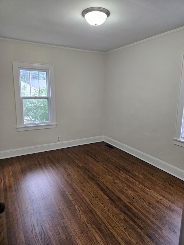 2742 Grand St NE, Minneapolis, MN 55418 - empty room featuring ornamental molding and dark wood finished floors