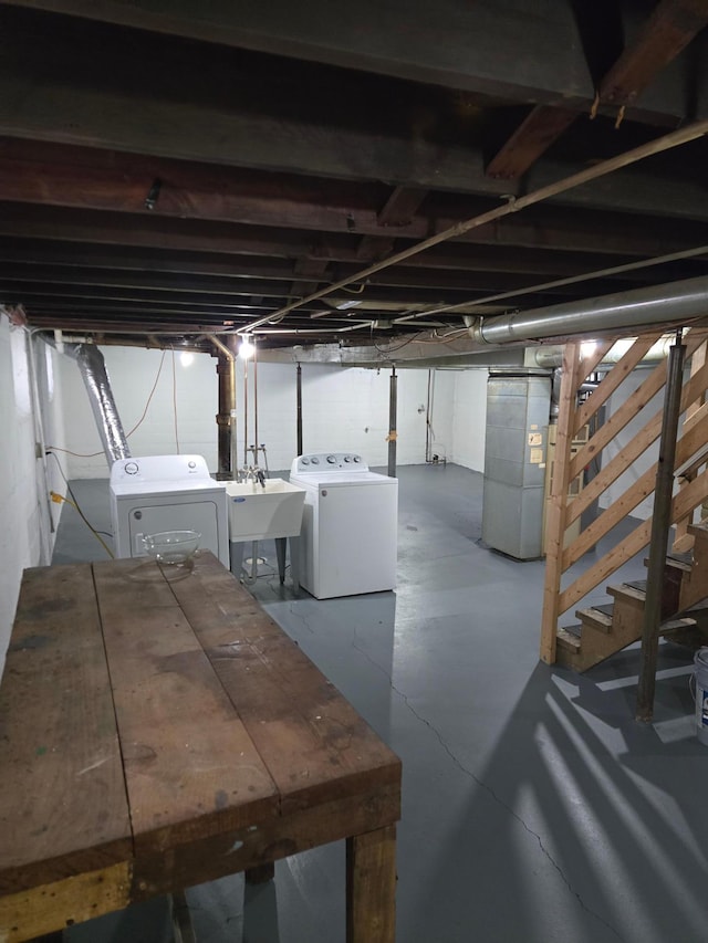 2742 Grand St NE, Minneapolis, MN 55418 - unfinished basement with washing machine and clothes dryer, stairway, and heating unit