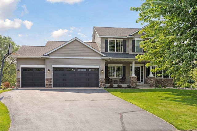 14896 Brenner Ct, Rosemount, MN 55068 - craftsman-style home with a porch, driveway, a garage, a front lawn, and stone siding