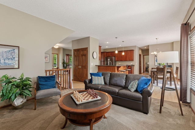 14896 Brenner Ct, Rosemount, MN 55068 - living room featuring light carpet and a chandelier
