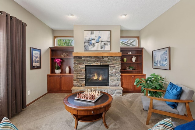 14896 Brenner Ct, Rosemount, MN 55068 - living area featuring carpet, a stone fireplace, and a textured ceiling