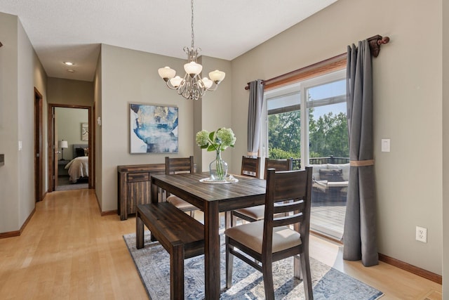 14896 Brenner Ct, Rosemount, MN 55068 - dining space featuring light wood finished floors and a chandelier