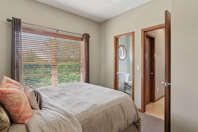 14896 Brenner Ct, Rosemount, MN 55068 - bedroom with ensuite bath and light colored carpet