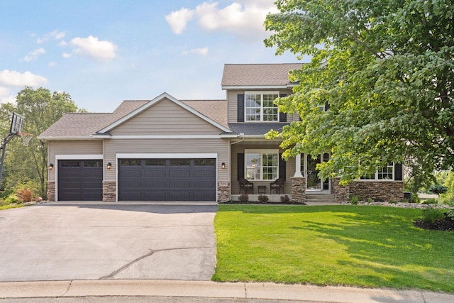 14896 Brenner Ct, Rosemount, MN 55068 - view of front of home featuring a porch, an attached garage, a front yard, concrete driveway, and stone siding