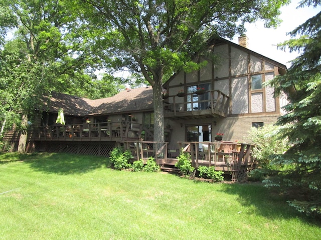 4523 Waville Rd NE, Bemidji, MN 56601 - rear view of property with a balcony, a chimney, a yard, and a deck