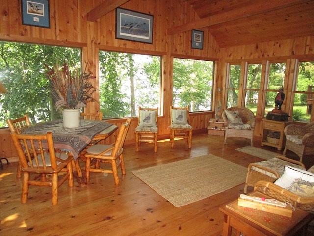 4523 Waville Rd NE, Bemidji, MN 56601 - sunroom featuring healthy amount of natural light, wooden walls, a wooden deck, and wood finished floors