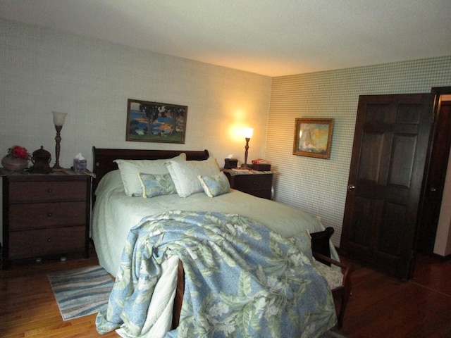 4523 Waville Rd NE, Bemidji, MN 56601 - bedroom featuring wallpapered walls and wood finished floors