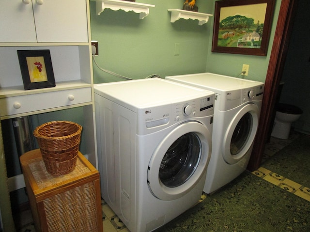 4523 Waville Rd NE, Bemidji, MN 56601 - washroom featuring washing machine and clothes dryer, cabinet space, and light flooring