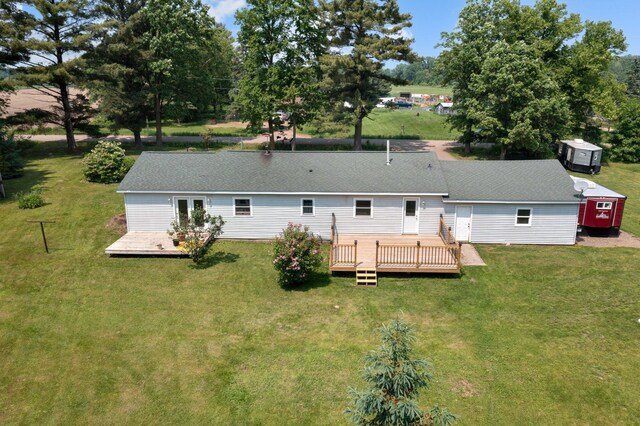 8241 120th St, Bogus Brook Twp, MN 56353 - back of house with a deck and a lawn