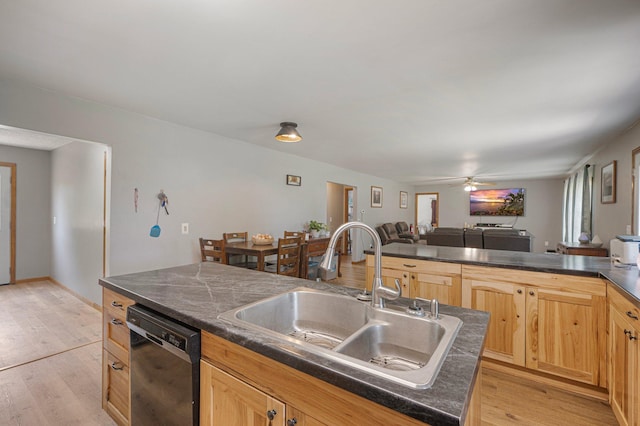 8241 120th St, Bogus Brook Twp, MN 56353 - kitchen with black dishwasher, dark countertops, light wood-style flooring, and open floor plan