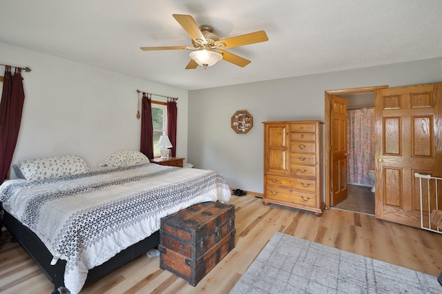 8241 120th St, Bogus Brook Twp, MN 56353 - bedroom featuring light wood-style floors and ceiling fan