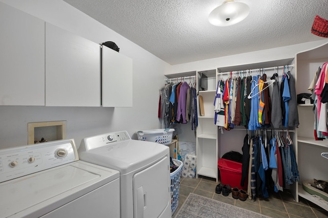 8241 120th St, Bogus Brook Twp, MN 56353 - laundry room featuring washing machine and clothes dryer, cabinet space, a textured ceiling, and tile patterned flooring