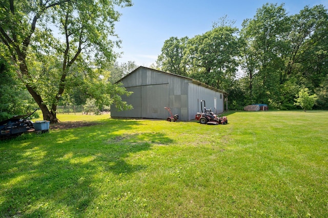 8241 120th St, Bogus Brook Twp, MN 56353 - view of grassy yard featuring a pole building and an outdoor structure