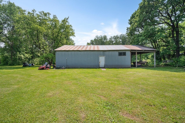 8241 120th St, Bogus Brook Twp, MN 56353 - view of pole building with a yard and a carport