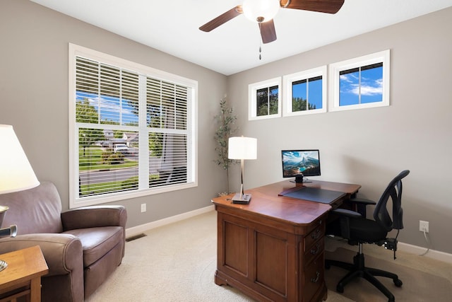 office area with light colored carpet and ceiling fan