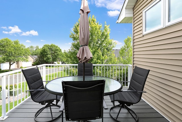 wooden deck with outdoor dining space