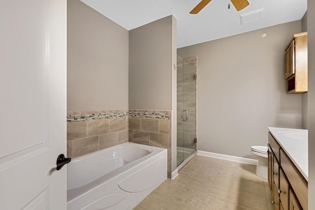 bathroom featuring a bath, vanity, a shower stall, ceiling fan, and tile patterned floors