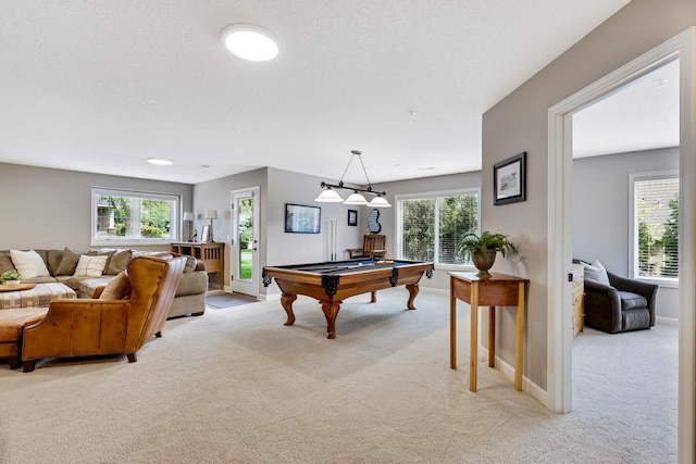 recreation room with light carpet and billiards table