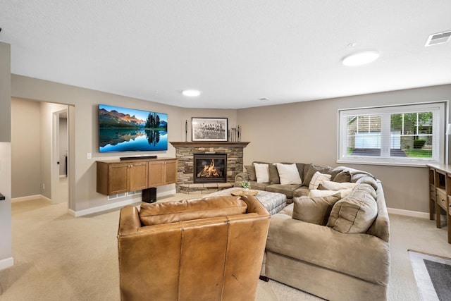 living area featuring light colored carpet and a fireplace