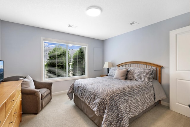 bedroom with light carpet