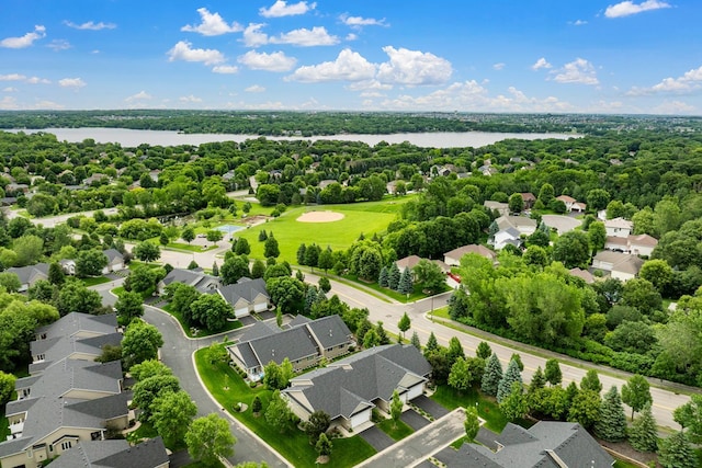 aerial view of residential area with a nearby body of water
