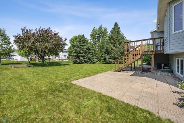 2819 33rd St S, Fargo, ND 58103 - view of grassy yard featuring a patio area, stairs, and a deck