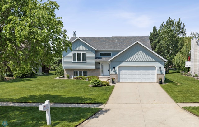 2819 33rd St S, Fargo, ND 58103 - view of front facade with brick siding, an attached garage, a front lawn, driveway, and roof with shingles