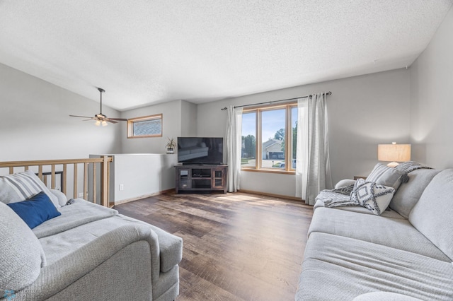 2819 33rd St S, Fargo, ND 58103 - living room with a textured ceiling, ceiling fan, wood finished floors, and lofted ceiling