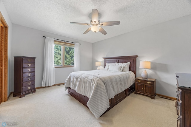 2819 33rd St S, Fargo, ND 58103 - bedroom featuring light carpet, a textured ceiling, and a ceiling fan