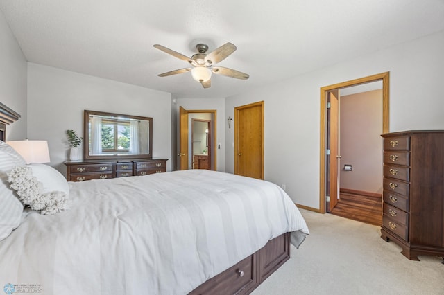 2819 33rd St S, Fargo, ND 58103 - bedroom featuring light colored carpet, a ceiling fan, and ensuite bath