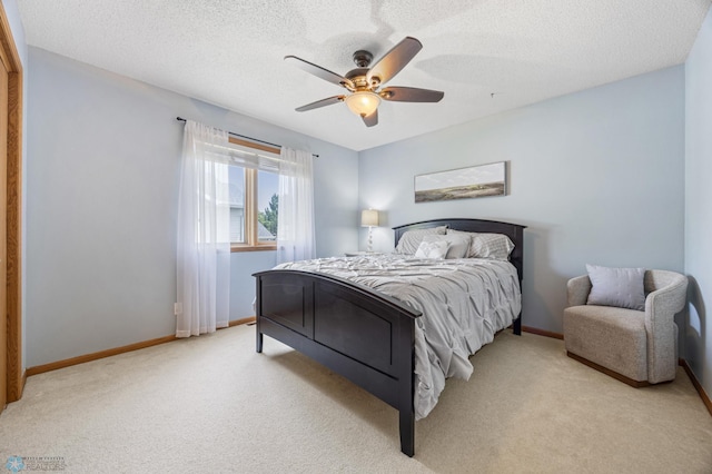 2819 33rd St S, Fargo, ND 58103 - bedroom featuring light colored carpet, a textured ceiling, and ceiling fan