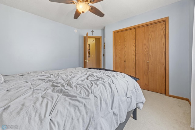 2819 33rd St S, Fargo, ND 58103 - bedroom featuring light colored carpet, a closet, and a ceiling fan