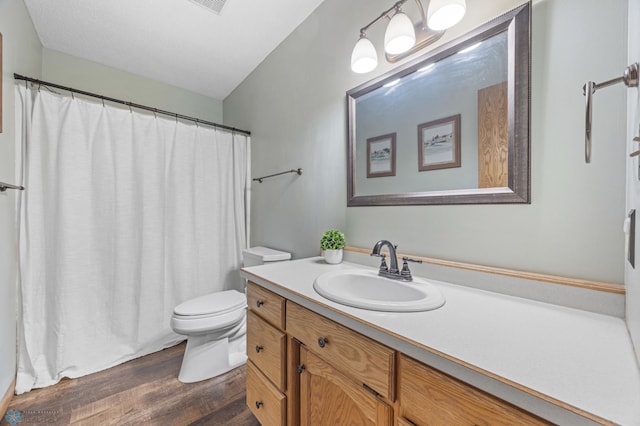 2819 33rd St S, Fargo, ND 58103 - full bath featuring wood finished floors, vanity, and curtained shower