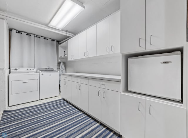 2819 33rd St S, Fargo, ND 58103 - laundry room with independent washer and dryer and cabinet space