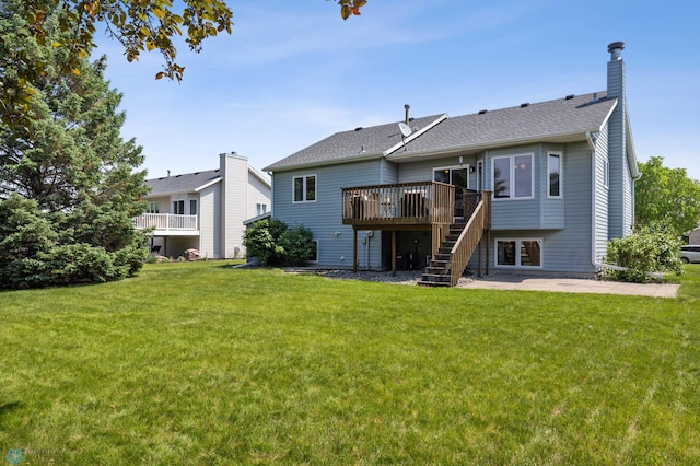 2819 33rd St S, Fargo, ND 58103 - rear view of house with a deck, stairway, a lawn, and a chimney