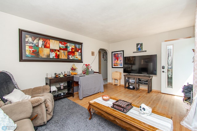419 18th St S, Moorhead, MN 56560 - living area with arched walkways and wood finished floors
