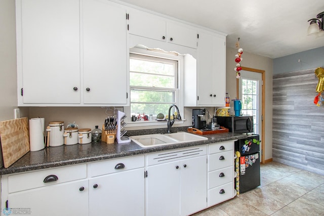 419 18th St S, Moorhead, MN 56560 - kitchen featuring dark countertops and white cabinetry