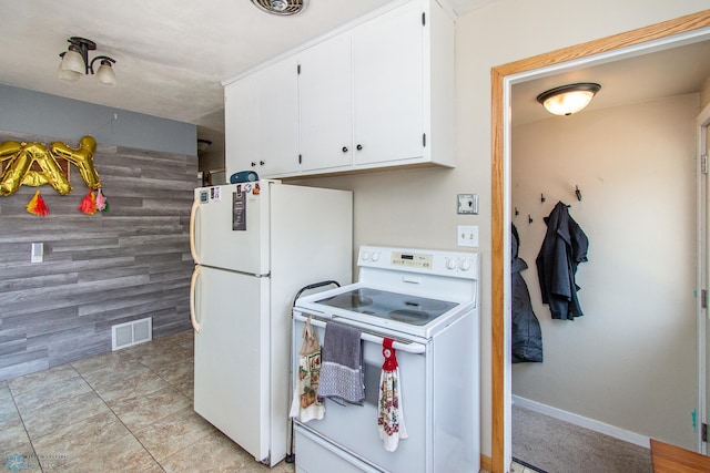 419 18th St S, Moorhead, MN 56560 - kitchen with white appliances, white cabinets, and light tile patterned floors