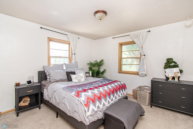 419 18th St S, Moorhead, MN 56560 - bedroom featuring light carpet and multiple windows